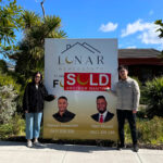 Happy clients of 17 Jillian Street Cranbourne VIC 3977. Standing in front of the SOLD billboard.